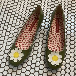 B.A.I.T. Green heels with daisy embellishment